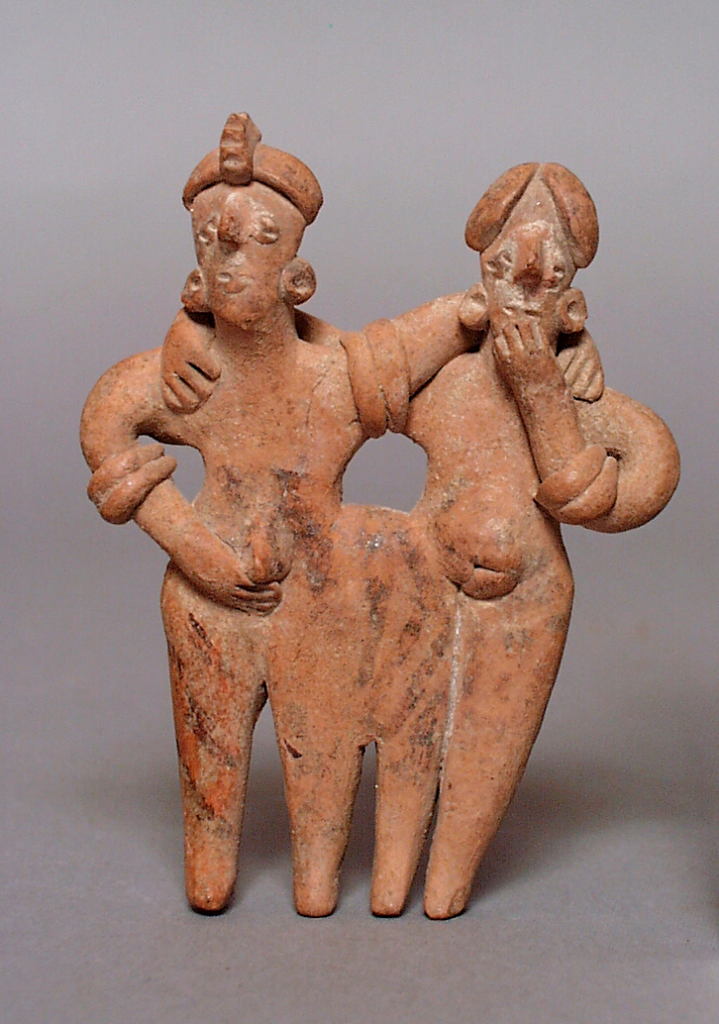 Photo of a ceramic figure representing a man and a woman hugging